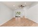 Bright living room with wood floors, ceiling fan and access to the screened lanai at 4424 Park Eden Cir, Orlando, FL 32810