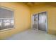 Covered porch leads to a bright room with window views of the backyard at 4424 Park Eden Cir, Orlando, FL 32810