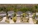 Aerial view of a suburban home with well-kept lawns and mature trees around the properties at 4561 Cabello Loop, Kissimmee, FL 34746