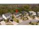 Aerial view of the home and surrounding properties with a red pin on top of the home at 4561 Cabello Loop, Kissimmee, FL 34746