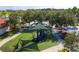 Aerial view of a community playground with covered structures and mature landscaping at 4561 Cabello Loop, Kissimmee, FL 34746