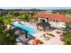 Stunning aerial view of a community pool and clubhouse with an inviting pool and lounge area at 4561 Cabello Loop, Kissimmee, FL 34746
