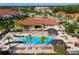 Stunning aerial view of a community pool and clubhouse with an inviting pool and lounge area at 4561 Cabello Loop, Kissimmee, FL 34746