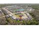 An aerial view shows the home nestled in a lush community near two lakes at 4561 Cabello Loop, Kissimmee, FL 34746