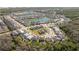 An aerial view shows the home nestled in a lush community near two lakes at 4561 Cabello Loop, Kissimmee, FL 34746