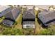 An elevated rear view highlights the screened-in pool and spacious green yard at 4561 Cabello Loop, Kissimmee, FL 34746