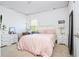 Comfortable bedroom featuring neutral tones and a cozy bed, a white dresser and decor at 4561 Cabello Loop, Kissimmee, FL 34746