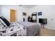 View of bedroom highlighting work desk with a white interior door and ensuite bathroom at 4561 Cabello Loop, Kissimmee, FL 34746
