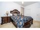 Spacious bedroom with a plush bed, bedside tables, and a neutral color palette at 4561 Cabello Loop, Kissimmee, FL 34746