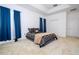 Bright bedroom with tray ceilings, double door closet and light carpet and dark bedspread at 4561 Cabello Loop, Kissimmee, FL 34746