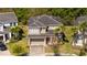 Well-maintained two-story home with a two-car garage and landscaped front yard at 4561 Cabello Loop, Kissimmee, FL 34746
