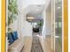Bright foyer with tile flooring, a staircase, and a view into the living room at 4561 Cabello Loop, Kissimmee, FL 34746