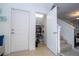 Hallway with storage area, stairs, and entry to living area at 4561 Cabello Loop, Kissimmee, FL 34746