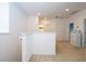 Bright loft area with neutral carpeting, white walls, and natural light, ready to personalize as a flex space at 4561 Cabello Loop, Kissimmee, FL 34746