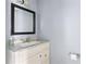 Half bath featuring vanity with marble countertop and modern faucet at 4907 Silver Oaks Vlg # D, Orlando, FL 32808