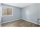 Empty bedroom with vinyl floors and one window at 4907 Silver Oaks Vlg # D, Orlando, FL 32808