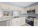 Well-equipped kitchen with stainless steel appliances and ample counter space at 4907 Silver Oaks Vlg # D, Orlando, FL 32808