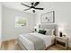 Bedroom with large window, plush bed, and stylish decor for a restful retreat at 5603 Marie Ct, Orlando, FL 32818