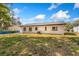Exterior of a charming home with a spacious backyard, offering plenty of room for outdoor activities at 5603 Marie Ct, Orlando, FL 32818