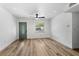 Bright living room with new floors, fresh paint and contemporary ceiling fan at 5603 Marie Ct, Orlando, FL 32818