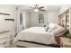 Relaxing bedroom with large windows, a comfortable bed, and tasteful decor at 6013 Thames Way, Orlando, FL 32807