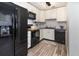 The modern kitchen features stainless steel appliances, sleek countertops, and ample cabinet space at 6013 Thames Way, Orlando, FL 32807