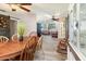 Open concept space with dining room flowing into the living room with comfortable seating at 6013 Thames Way, Orlando, FL 32807