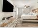 Spacious bedroom with hardwood floors, large windows, and a decorative wooden headboard at 6013 Thames Way, Orlando, FL 32807
