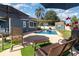 Enjoy this backyard pool with patio furniture, privacy fence, and well-kept lawn at 6013 Thames Way, Orlando, FL 32807