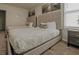 Bedroom with two twin beds, each featuring a patterned comforter and decorative pillows at 6049 Broad Oak Dr, Davenport, FL 33837