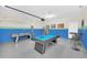 Spacious game room with pool table, air hockey table, and colorful decor at 6049 Broad Oak Dr, Davenport, FL 33837