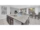 Kitchen island featuring sink with white granite countertops, dishwasher and barstool seating at 6049 Broad Oak Dr, Davenport, FL 33837