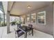 Covered patio with outdoor seating and a grill for al fresco dining at 6049 Broad Oak Dr, Davenport, FL 33837