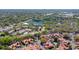 Expansive aerial shot featuring community, surrounding greenery, a peaceful lake, and clubhouse at 698 Seabrook Ct # 103, Altamonte Springs, FL 32714