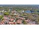 Beautiful aerial view of the community featuring mature landscaping and community pool near a pond at 698 Seabrook Ct # 103, Altamonte Springs, FL 32714