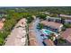 Scenic aerial view highlighting community with condo buildings, pool, garages, and lush surroundings at 698 Seabrook Ct # 103, Altamonte Springs, FL 32714
