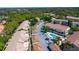 Scenic aerial view highlighting community with condo buildings, pool, garages, and lush surroundings at 698 Seabrook Ct # 103, Altamonte Springs, FL 32714