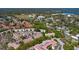 Scenic aerial view of the community, showcasing the pool, tennis courts, and nearby lake at 698 Seabrook Ct # 103, Altamonte Springs, FL 32714