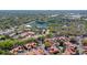 Expansive aerial shot featuring community, surrounding greenery, a peaceful lake, and clubhouse at 698 Seabrook Ct # 103, Altamonte Springs, FL 32714