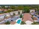 Beautiful aerial view of community featuring condos, townhomes, pool and mature landscaping at 698 Seabrook Ct # 103, Altamonte Springs, FL 32714