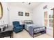 Comfortable bedroom featuring a full-sized bed, accent chair, and neutral decor, lit by a window at 698 Seabrook Ct # 103, Altamonte Springs, FL 32714