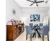 Cozy dining area with a modern chandelier, a glass-topped table with seating for four at 698 Seabrook Ct # 103, Altamonte Springs, FL 32714