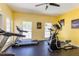 Well-equipped fitness center with cardio machines, natural light, and motivational artwork at 698 Seabrook Ct # 103, Altamonte Springs, FL 32714
