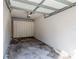 Spacious garage with ample storage cabinets, and bare concrete floors at 698 Seabrook Ct # 103, Altamonte Springs, FL 32714