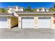 Attached garages with clear numbering on a sunny day showcasing convenient parking at 698 Seabrook Ct # 103, Altamonte Springs, FL 32714