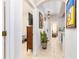 Bright hallway with tile flooring leading to a living space with natural light and stylish decor at 698 Seabrook Ct # 103, Altamonte Springs, FL 32714
