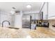Contemporary kitchen featuring stainless steel appliances and an eat-in breakfast bar at 698 Seabrook Ct # 103, Altamonte Springs, FL 32714