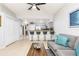 Open concept living space featuring breakfast bar, comfortable seating, and access to the kitchen at 698 Seabrook Ct # 103, Altamonte Springs, FL 32714