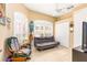 Versatile living space with neutral tones, shuttered windows, a ceiling fan, and comfortable furnishings at 698 Seabrook Ct # 103, Altamonte Springs, FL 32714