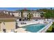 Inviting community pool surrounded by lounge chairs and well-maintained condo buildings at 698 Seabrook Ct # 103, Altamonte Springs, FL 32714